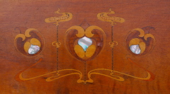 Close up inlays of various woods and mother of pearl. 